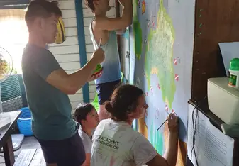 Updating dive map mural in the project house