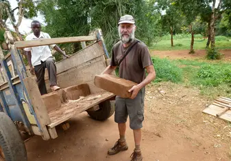 Unloading bricks for building toilet walls - Muungano - April 2018