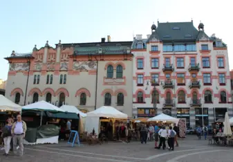 I went to a concert in Plac Szczepanski with bands, dancers, and soloists. There were vendors selling clothing, jewelry, and food.