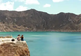 A friend and I sitting at el Lago Quilotoa
