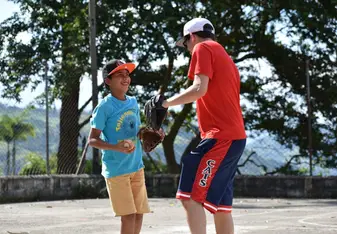 One of the pictures of me teaching baseball to a kid named Jose in Titiribi, Antioquia during my internship