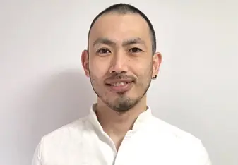 portrait image of a man an in front of a white screen