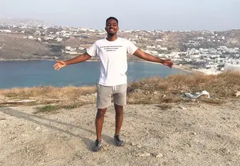 This is a picture of me on top of a hill in Mykonos Greece