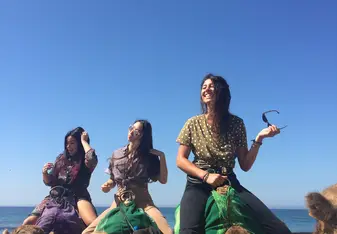 My friends and I riding camels.