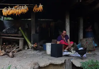 This was my last homestay in Thailand and here is a photo of one of my homestay family members preparing dinner for Gracie and I.