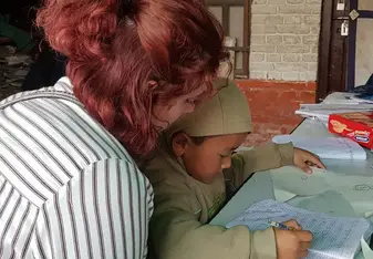 I was helping kalden with his homework at the orphanage 