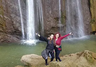 Me with another volunteer at a hideaway waterfall