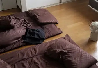Mine and my roommate's sleeping situation, ft. my tiny head fan.