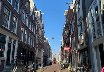 Classic street in Amsterdam with bikes and old buildings