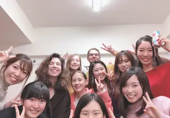 a selfie of a group of students smiling and making the peace sign