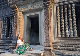 Kelly posing at a temple