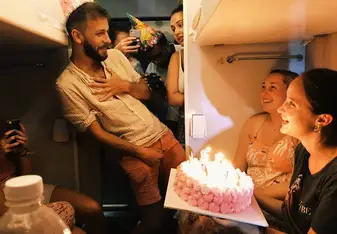 Sam being presented with a birthday cake