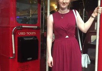 Sophie on a red London bus