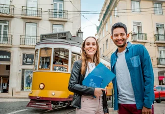 Students pose in front of a cablecar in Lisbon, Portugal