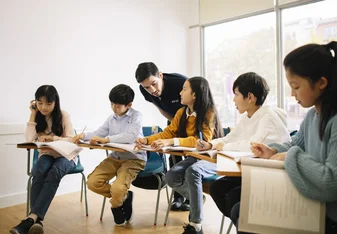 Teacher examining work