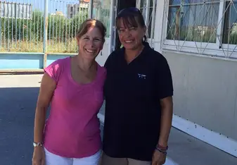 Samantha and another woman pose for a photo