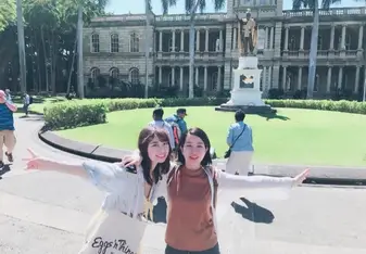Nanami poses with an intern in a garden
