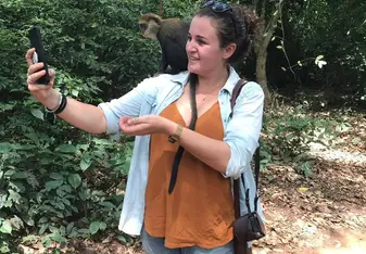 Libby taking a selfie with a monkey