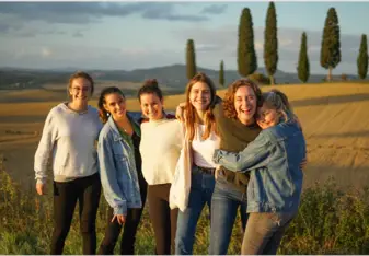 Alexa poses with friends in the Italian countryside