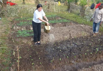 A volunteer taking up gardening