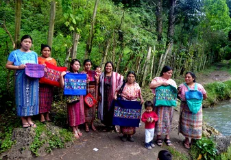 Weavers showing off their hand-woven pillows