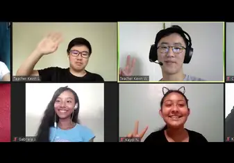 2 volunteer English teachers with 2 young Latin American students in Zoom
