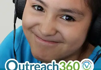 young student wearing head phones smiling at camera, Outreach360 logo at bottom