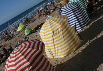 Senic and historical canopies on the Main Beach in Biarritz, France