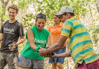 Volunteers and community members work together during the community project