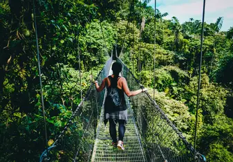 Woman on a bridge in Costa Rica.