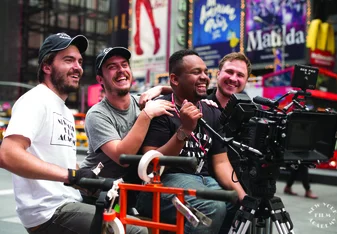 Man holds camera in Times Square