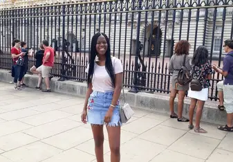 Kagiso J. in front of building