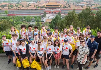 group of students in front of the Chinese historical building