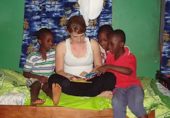 Ali reading to some of the local children