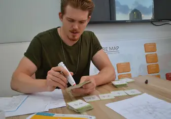 Person gluing flashcards