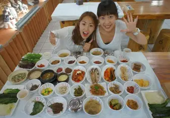 Kyung J eating food