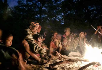 San Bushmen sitting around the fire at a Healing dance event