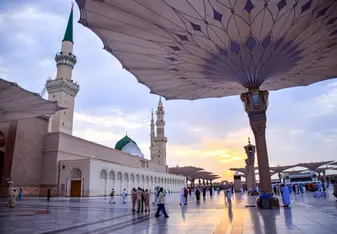 People walking outside a Mosque in Saudi Arabia