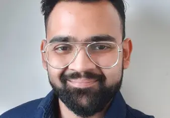 hritik tayade smiling with glasses 