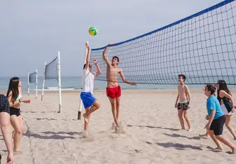 CAMPERS PLAYING BEACH VOLLEY AT IBERIAN CAMPS