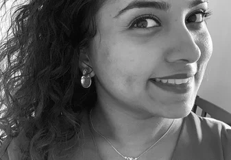 A black and white selfie of Kithmi Pathirana with curly hair
