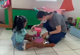 A Therapy Abroad volunteer playing with a child