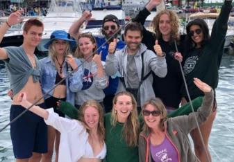 Vanessa Rees with a group on a boat smiling
