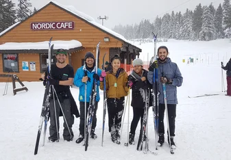 skiers pose for a group photo