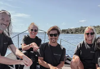 Joma Dix with Project Laut team on a boat