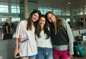 Brittany Shelley with two high school students smiling