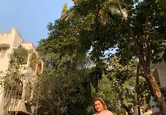 Vineeta Chauhan in India under trees on a road