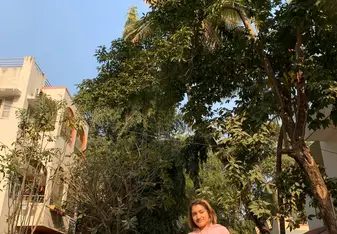 Vineeta Chauhan in India under trees on a road