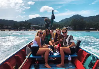 Samantha P on a boat in Thailand with other gap year students