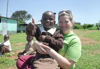 volunteer with a young girl